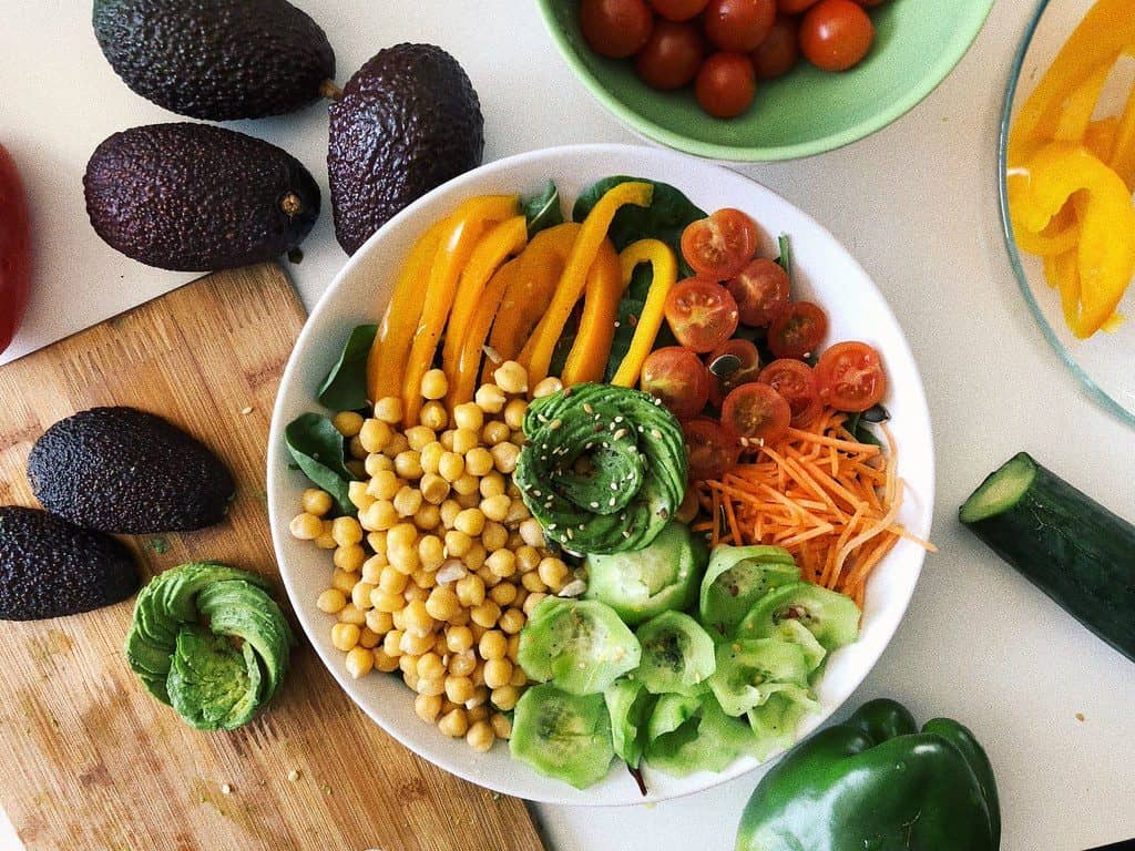 A colourful buddha bowl of chickpeas and fresh vegetables